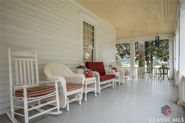 sunroom with wooden ceiling and vaulted ceiling