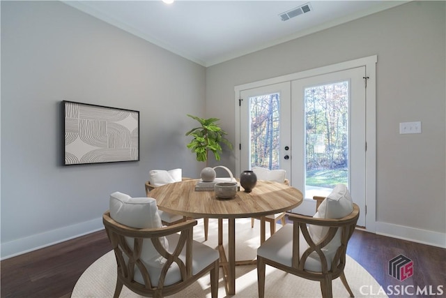 dining space featuring french doors and dark hardwood / wood-style flooring