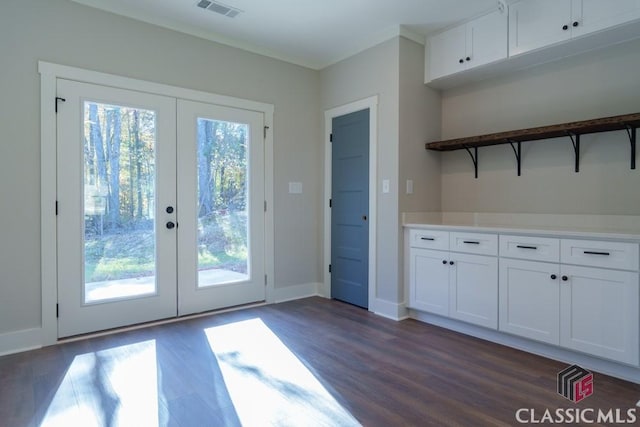 doorway with dark hardwood / wood-style flooring and french doors