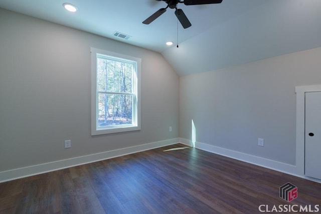 bonus room with vaulted ceiling, ceiling fan, and dark hardwood / wood-style flooring