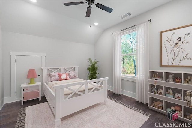 bedroom featuring ceiling fan, dark hardwood / wood-style floors, and vaulted ceiling