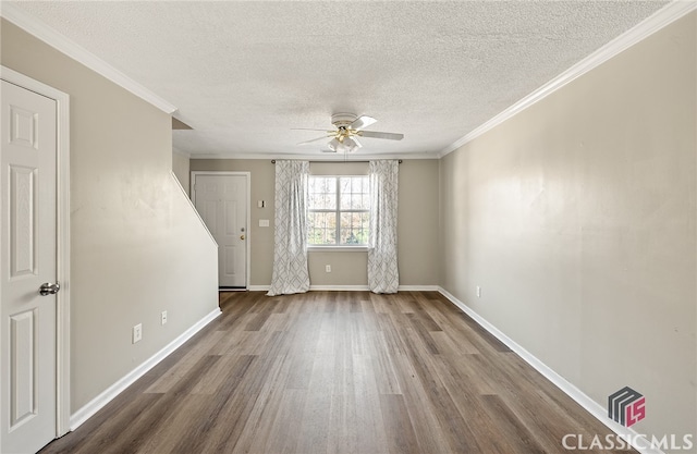 unfurnished room featuring hardwood / wood-style floors, a textured ceiling, ceiling fan, and crown molding