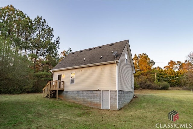 view of side of home featuring a yard