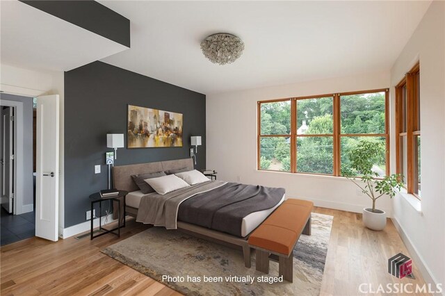 bedroom with light hardwood / wood-style flooring