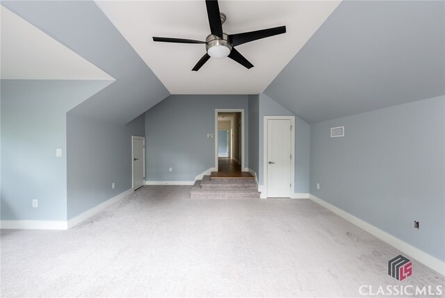 bonus room featuring light colored carpet, ceiling fan, and lofted ceiling