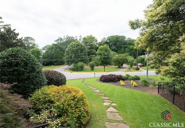 view of home's community featuring a lawn