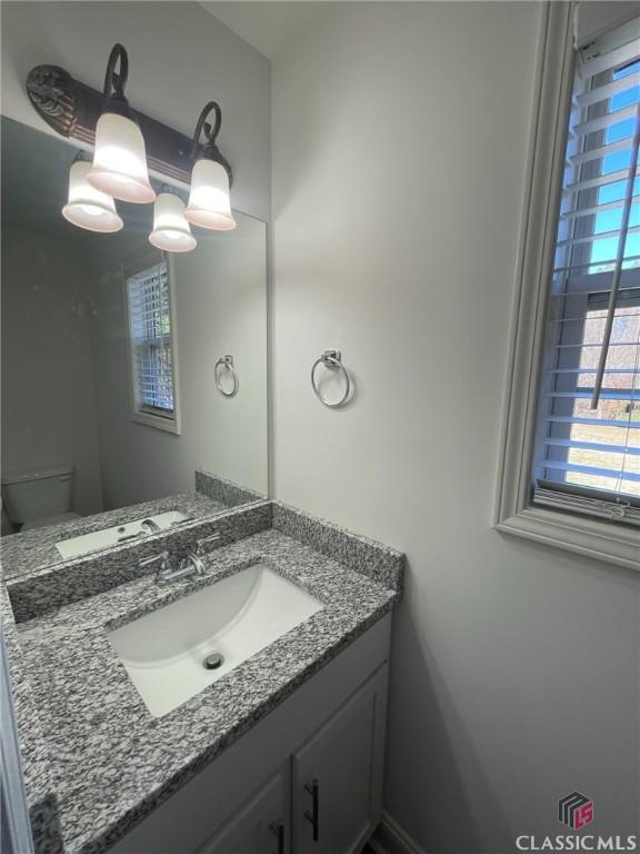 bathroom with vanity and toilet