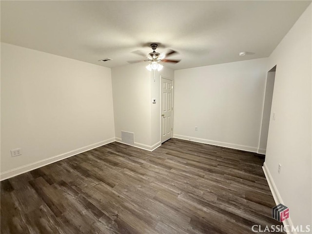 unfurnished room featuring ceiling fan and dark wood-type flooring