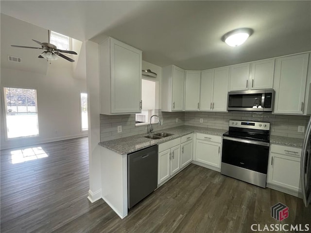 kitchen featuring white cabinetry, sink, and stainless steel appliances