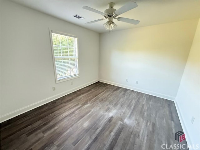 unfurnished room with dark hardwood / wood-style floors and ceiling fan