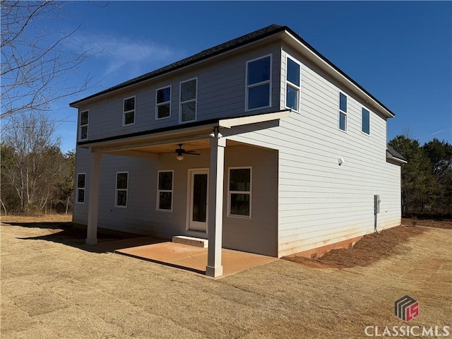 back of property with a patio area and ceiling fan