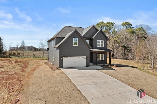 view of front of property with an attached garage, board and batten siding, and concrete driveway