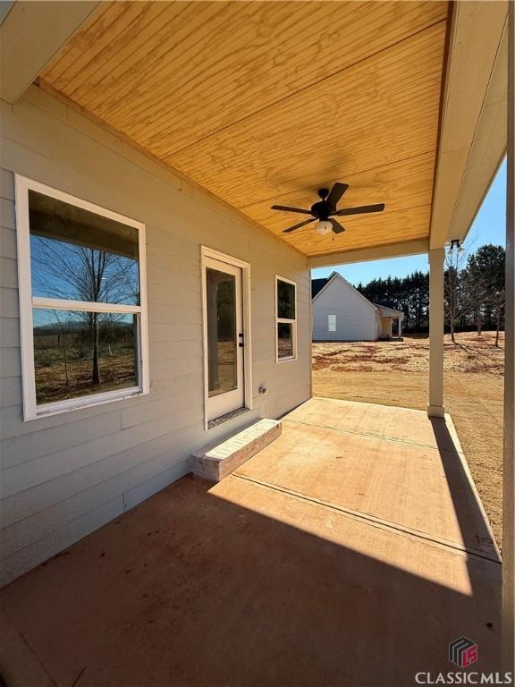 view of patio / terrace featuring ceiling fan