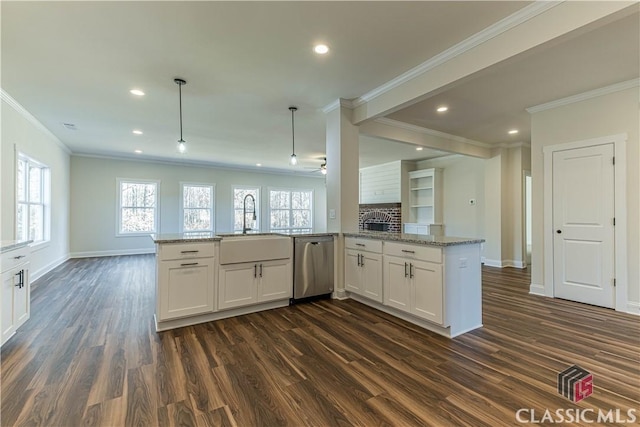 kitchen with sink, light stone counters, dishwasher, pendant lighting, and white cabinets