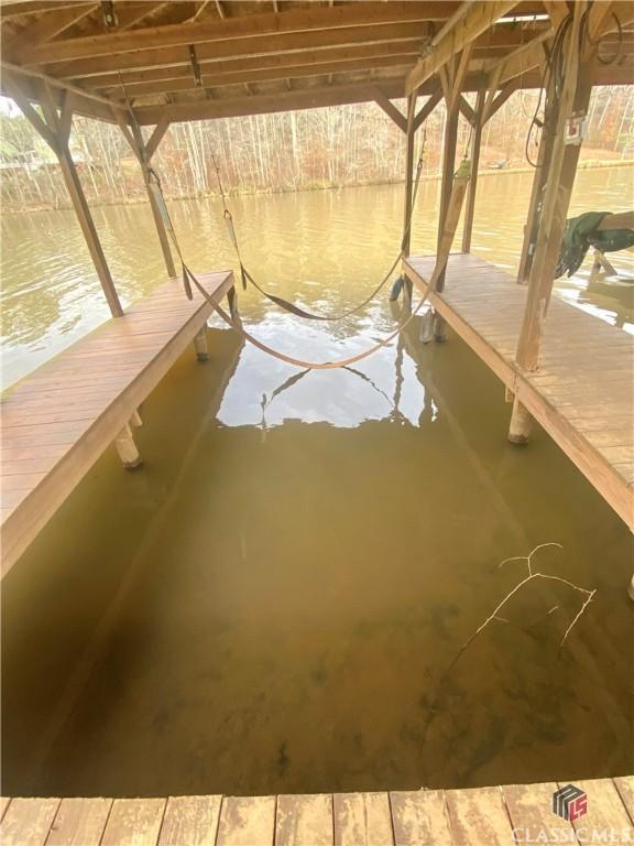 view of dock with a water view