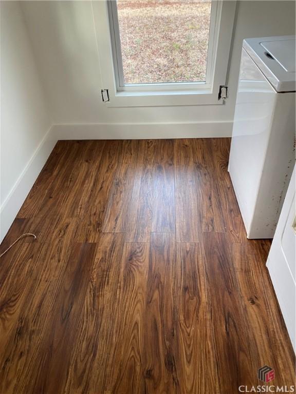 interior space featuring washer / dryer and dark hardwood / wood-style floors