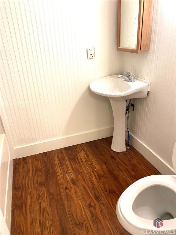 bathroom with wood-type flooring