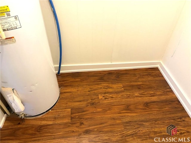 room details featuring wood-type flooring and water heater