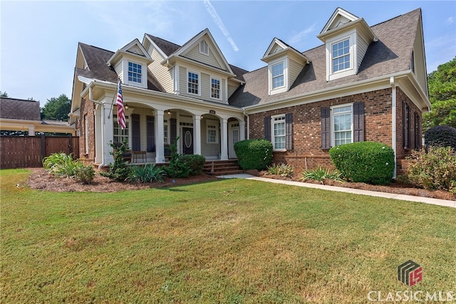 view of front of property featuring a porch and a front lawn