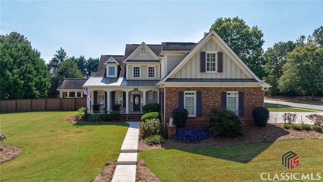 view of front of property with a front lawn and a porch