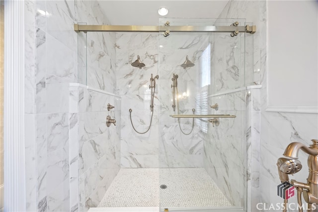 full bath with a marble finish shower