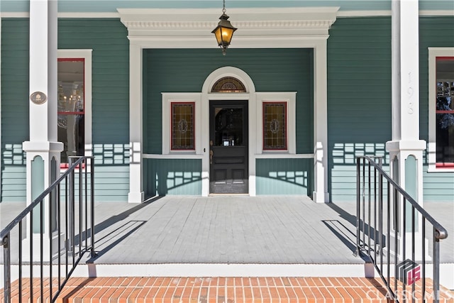 entrance to property featuring a porch