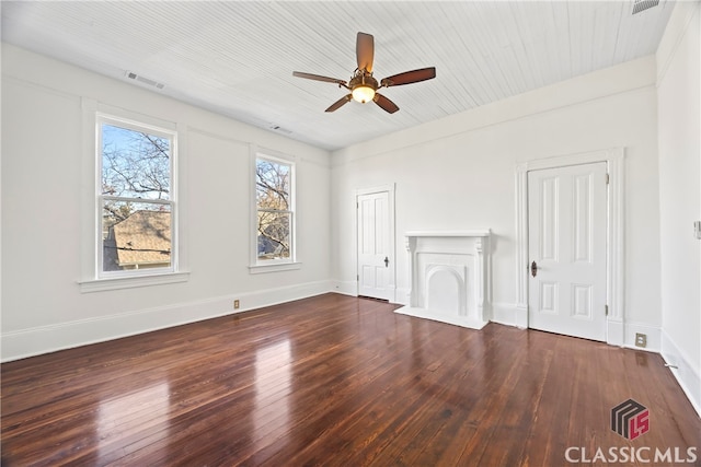 unfurnished living room with hardwood / wood-style floors, baseboards, a ceiling fan, and visible vents