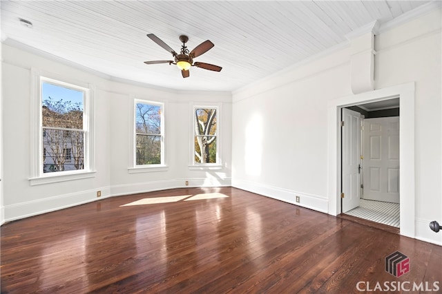 empty room with a ceiling fan, crown molding, wood finished floors, wooden ceiling, and baseboards