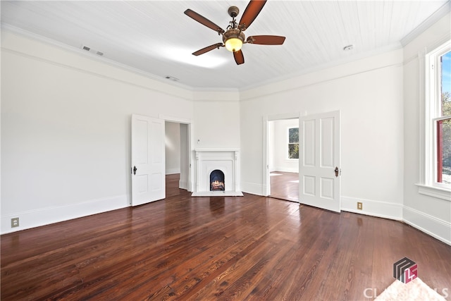unfurnished living room featuring wood finished floors, visible vents, a wealth of natural light, and ceiling fan