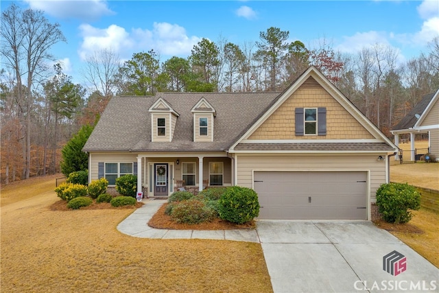 view of front of house featuring covered porch and a garage