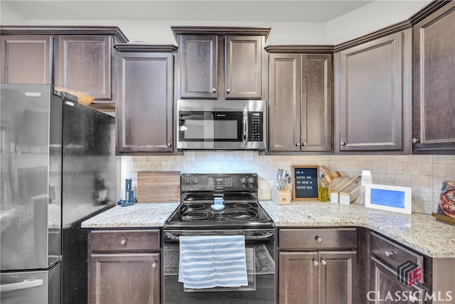 kitchen with stainless steel appliances, dark brown cabinetry, backsplash, and light stone countertops