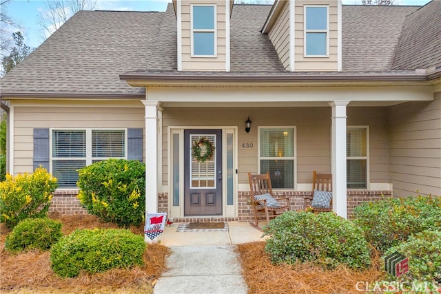 doorway to property featuring a porch