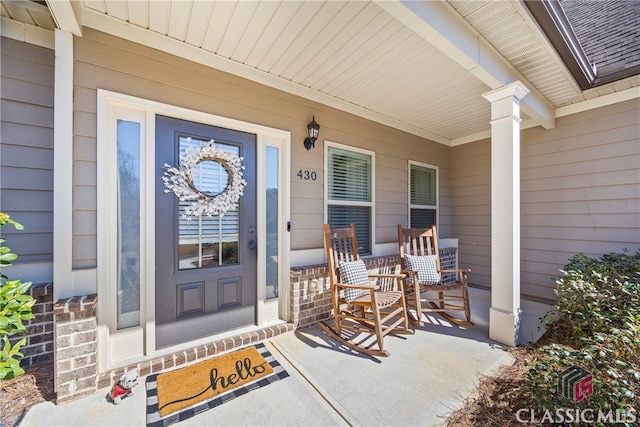 doorway to property featuring covered porch