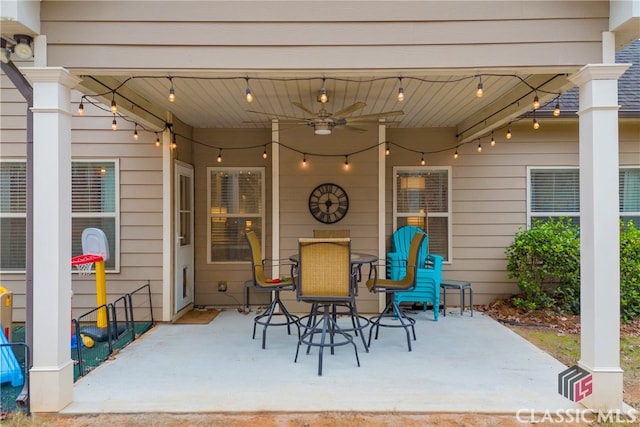 view of patio with outdoor dining space and a ceiling fan