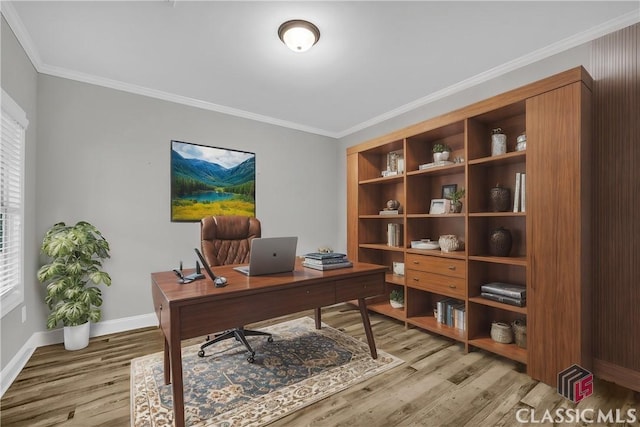 office area featuring a healthy amount of sunlight, crown molding, and light hardwood / wood-style floors