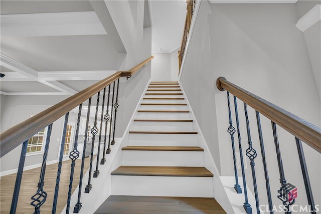 stairs with beam ceiling, wood-type flooring, and coffered ceiling