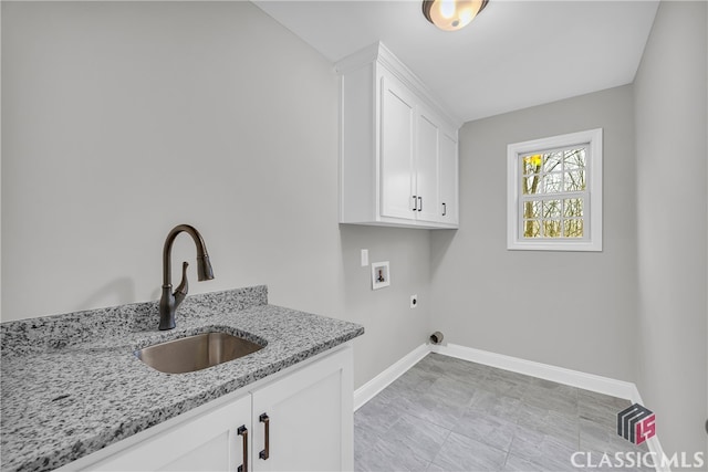 laundry area with hookup for an electric dryer, sink, cabinets, and washer hookup