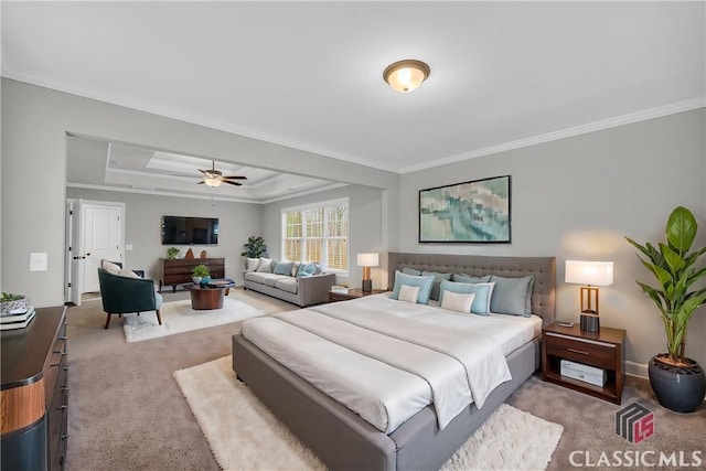 bedroom featuring carpet flooring, a raised ceiling, ceiling fan, and crown molding