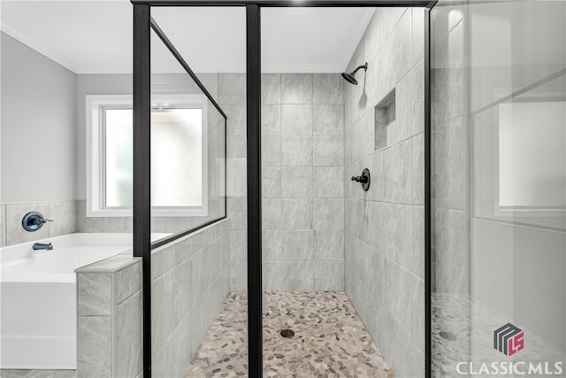 bathroom featuring shower with separate bathtub and ornamental molding