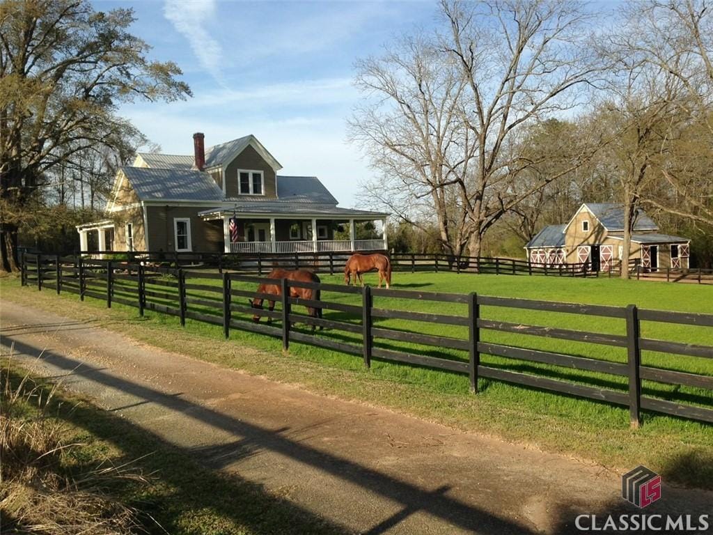 view of front of house with a rural view