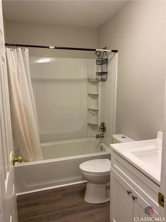 full bathroom with shower / bath combination with curtain, vanity, wood-type flooring, and toilet