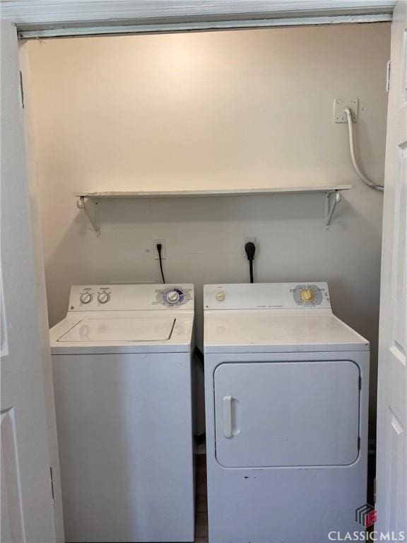 laundry room with independent washer and dryer