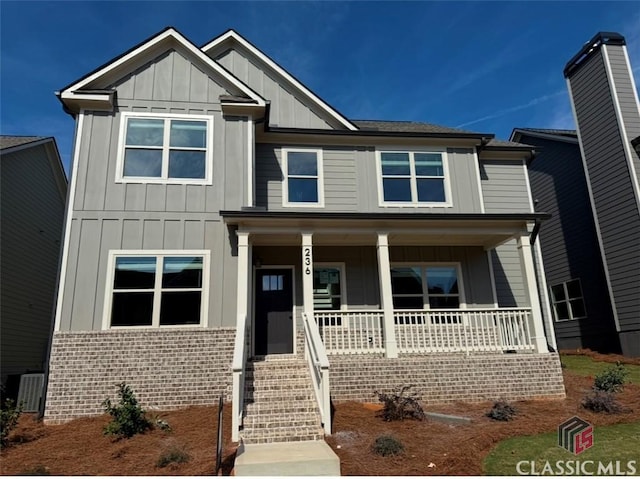 view of front of house featuring central AC unit and covered porch