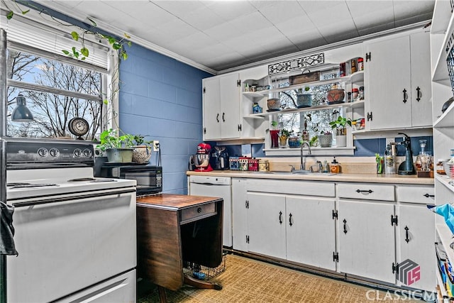 kitchen featuring stove, white dishwasher, crown molding, sink, and white cabinets