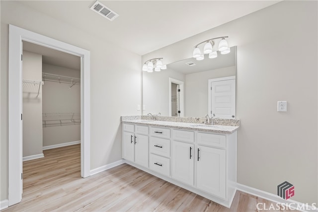 bathroom featuring hardwood / wood-style floors and vanity