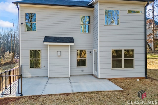 rear view of property featuring a patio area