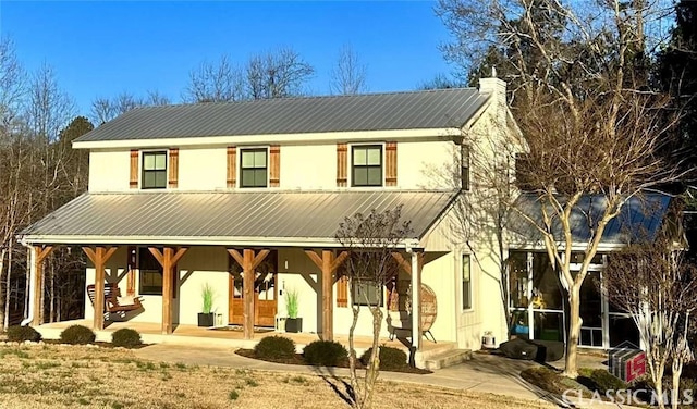 view of front of property featuring a patio