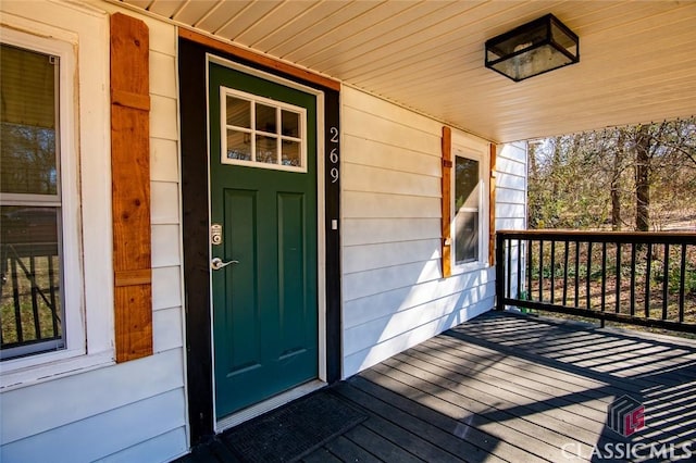 doorway to property with a porch