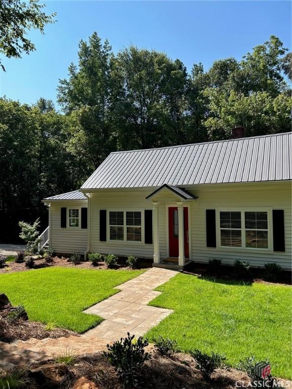 ranch-style house with a front lawn