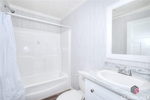 full bathroom featuring vanity, shower / tub combo, a textured ceiling, and toilet